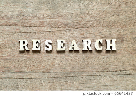 Letter block in word research on wood background Letter block in word research on wood background 65641487