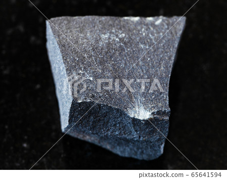 unpolished Hyalobasalt rock on black 65641594