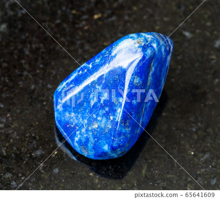 polished Lapis Lazuli (Lazurite) rock on black 65641609