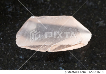 rough Topaz crystal on black rough Topaz crystal on black 65641618