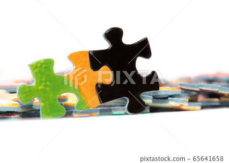 Two bright puzzle pieces connected 65641658