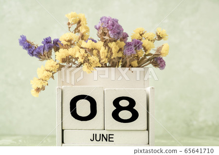 White cube calendar for june on green background White cube calendar for june on green background 65641710