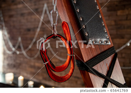 Sexual kink and erotic games concept. Complete sex toy kit set - cuffs, collar and leash for BDSM fantasy play and bondage restraints. 65641769