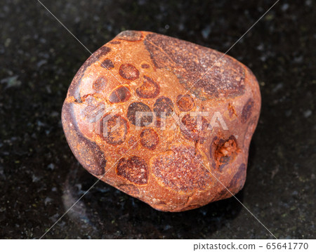 tumbled Bauxite rock on black 65641770