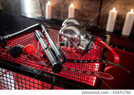 Sexual kink and erotic games concept. Complete sex toy kit set - cuffs, collar and leash for BDSM fantasy play and bondage restraints. 65641786