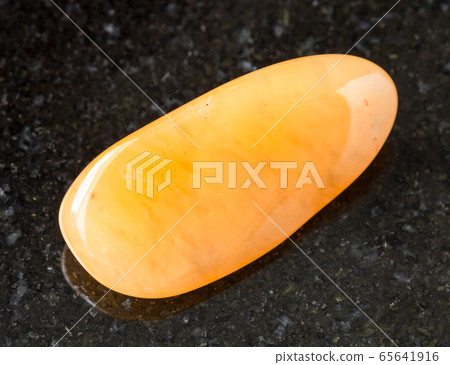 tumbled yellow chalcedony rock on black tumbled yellow chalcedony rock on black 65641916