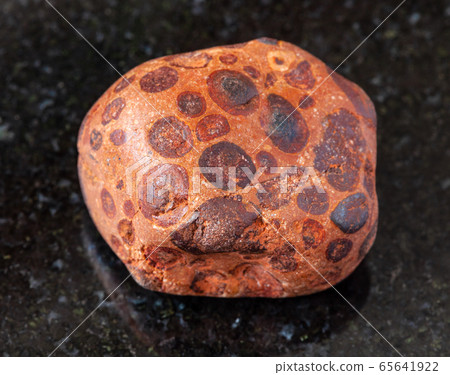 polished Bauxite rock on black 65641922