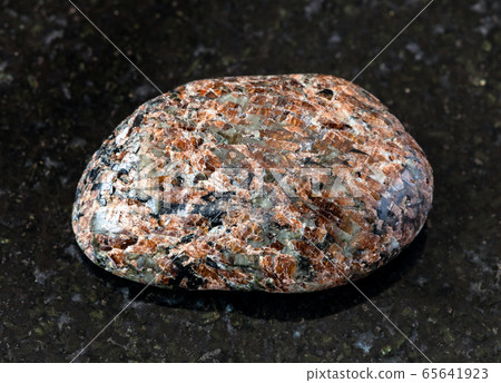 polished Titanite (Sphene) rock on black polished Titanite (Sphene) rock on black 65641923