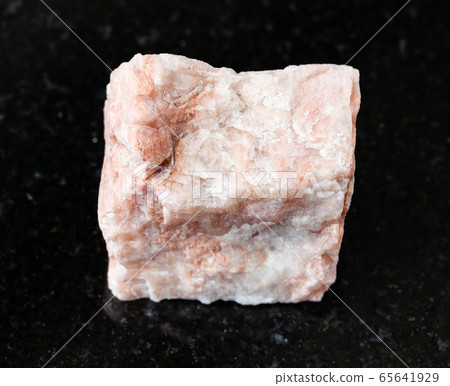 unpolished Feldspar rock on black 65641929