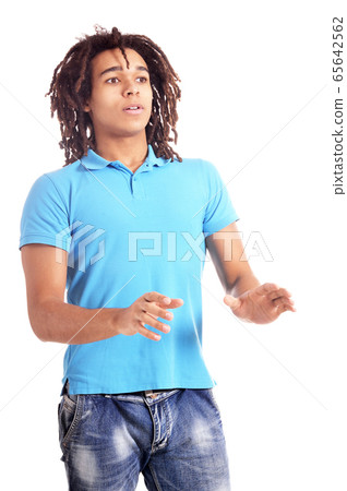 Portrait of scared young man against white background 65642562
