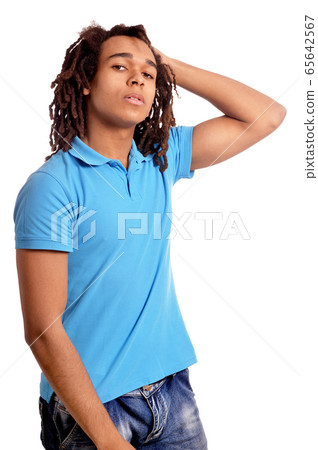 Portrait of young man posing against white background Portrait of young man posing against white background 65642567