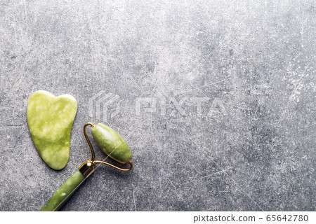 Jade face roller and Gua sha stone 65642780