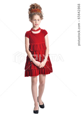 Portrait of girl in red dress posing isolated on white background Portrait of girl in red dress posing isolated on white background 65642868