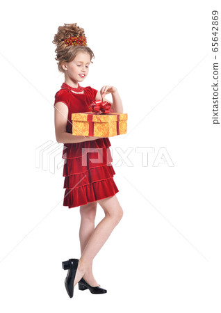 Portrait of cute girl in red dress holding gift box Portrait of cute girl in red dress holding gift box 65642869