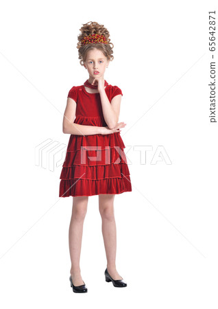 Portrait of girl in red dress posing isolated on white background Portrait of girl in red dress posing isolated on white background 65642871