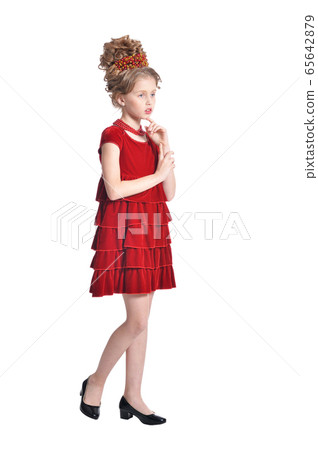 Portrait of girl in red dress posing isolated on white background Portrait of girl in red dress posing isolated on white background 65642879