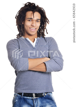 Handsome young man pointing against white background Handsome young man pointing against white background 65642910