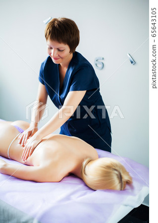 Close-up of a Beautiful Woman Getting Spa Treatment In Beauty Clinic Close-up of a Beautiful Woman Getting Spa Treatment In Beauty Clinic 65643105