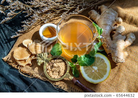 Hot Ginger juice with lemon and mint, root and Hot Ginger juice with lemon and mint, root and 65644632