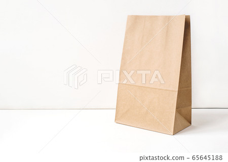 Paper craft bag on a white background. 65645188