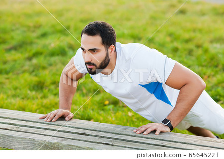 Fitness. Young man running in urban environment 65645221