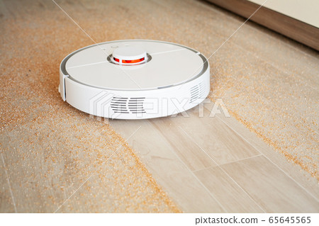 Robot vacuum cleaner performs automatic cleaning of the apartment at a certain time. Smart home. Robot vacuum cleaner performs automatic cleaning of the apartment at a certain time. Smart home. 65645565