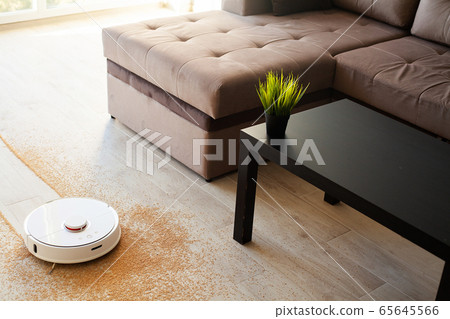 Robot vacuum cleaner performs automatic cleaning of the apartment at a certain time. Smart home. Robot vacuum cleaner performs automatic cleaning of the apartment at a certain time. Smart home. 65645566