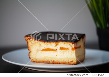 Delicious piece of chocolate cake on a white plate 65645648