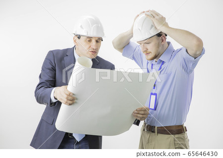Head of project and chief engineer discussing mistakes and problems in project 65646430