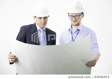 Mining engineer and architect working, measuring layout of building blueprint 65646453