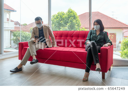 Business employees wearing mask during work in office to keep hygiene  65647249