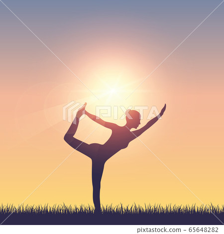 girl makes yoga on summer meadow at sunshine girl makes yoga on summer meadow at sunshine 65648282