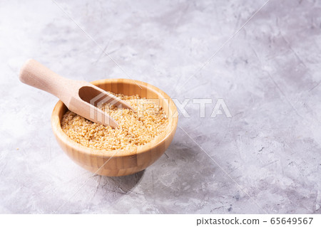 Uncooked raw dry bulgur wheat grains in a bowl 65649567
