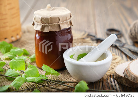 Bottle of birch salve, balm or tar oil. Bottle of birch salve, balm or tar oil. 65649755