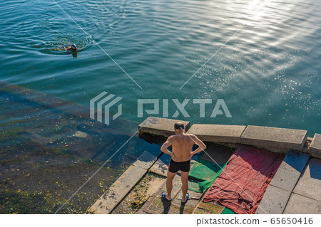 Chinese people swimming in the Hai River 65650416