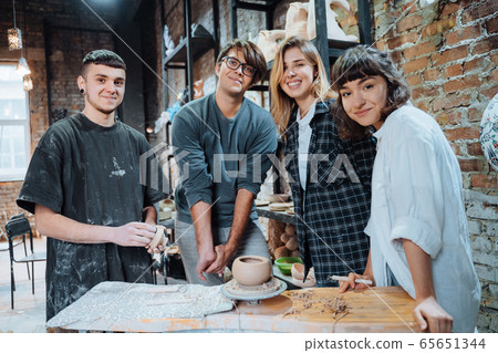 Making a handmade clay pot. Pottery lesson with master. 65651344