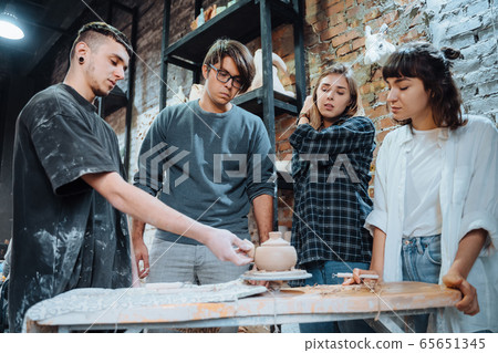 Making a handmade clay pot. Pottery lesson with master. 65651345