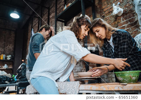 Making a handmade clay pot. Pottery lesson, hobby. 65651360