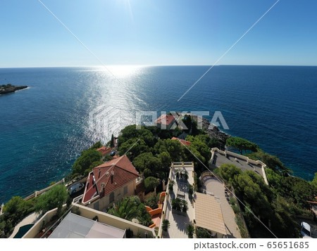 France, Cote Dazur, Beaulieu, 02 October 2019: Aerial view of French Riviera's terraces of expensive country houses and estates, palm trees, pools, haise lounges 65651685