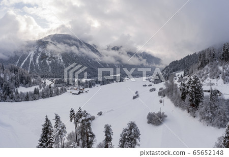 Aerial View of the Landwasser Viaduct with Railway without famous train at winter, landmark of Switzerland, snowing, river and mountains Aerial View of the Landwasser Viaduct with Railway without famous train at winter, landmark of Switzerland, snowing, river and mountains 65652148