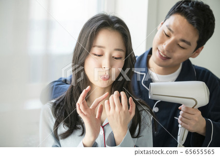 Couple, hair dryer, pajamas 65655565