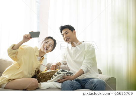 Couple, laundry, lifestyle Couple, laundry, lifestyle 65655769