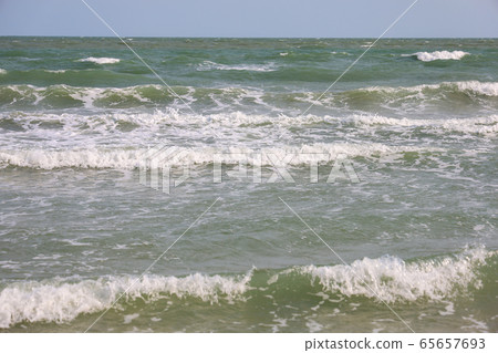 Close up the top wave on sea at Thailand in spring Close up the top wave on sea at Thailand in spring 65657693