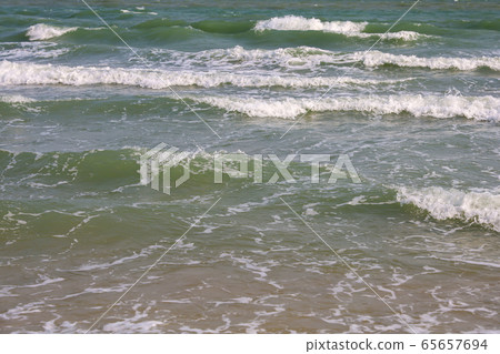 Close up the top wave on sea at Thailand in spring Close up the top wave on sea at Thailand in spring 65657694