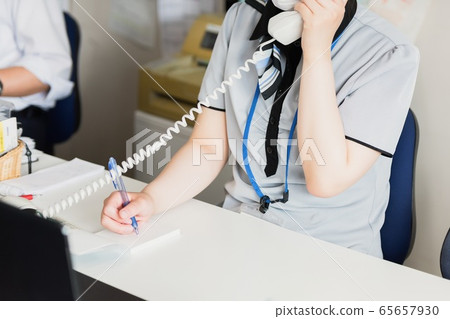 A woman making a phone call A woman making a phone call 65657930