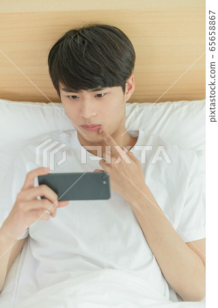 Single life concept, young cheerful Asian man's... - Stock Photo ...