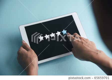 Woman hands give five star rating review on Woman hands give five star rating review on 65659701