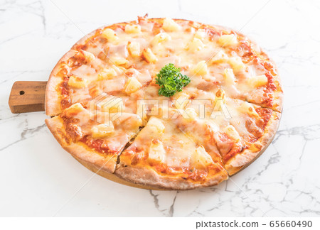 hawaiian pizza on table 65660490