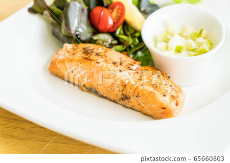 salmon steak with salad salmon steak with salad 65660803