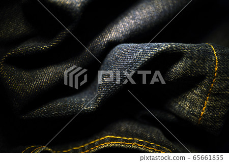 A close up texture background of blue jeans fabric A close up texture background of blue jeans fabric 65661855